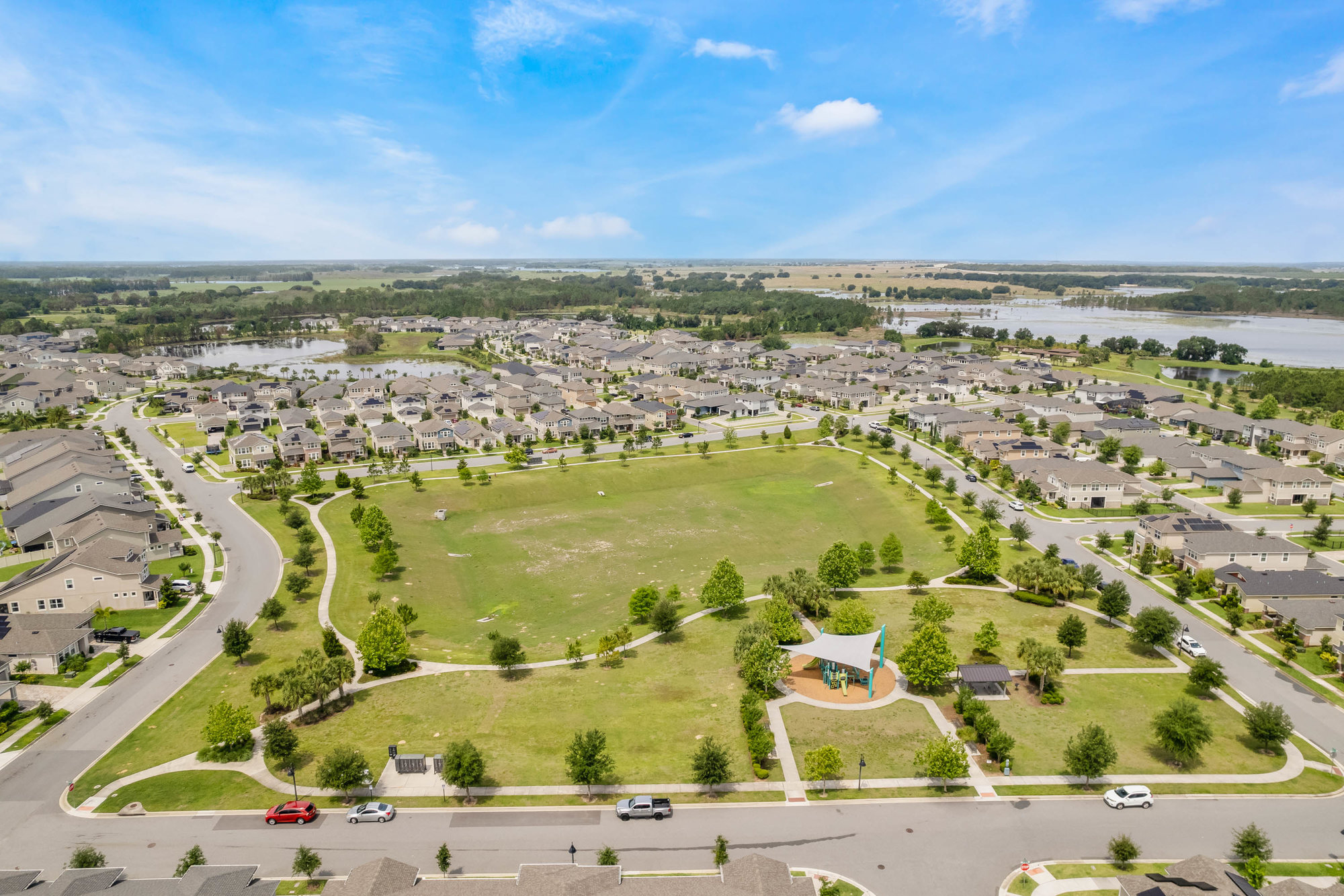 drone shot of hawksmoor community with large field